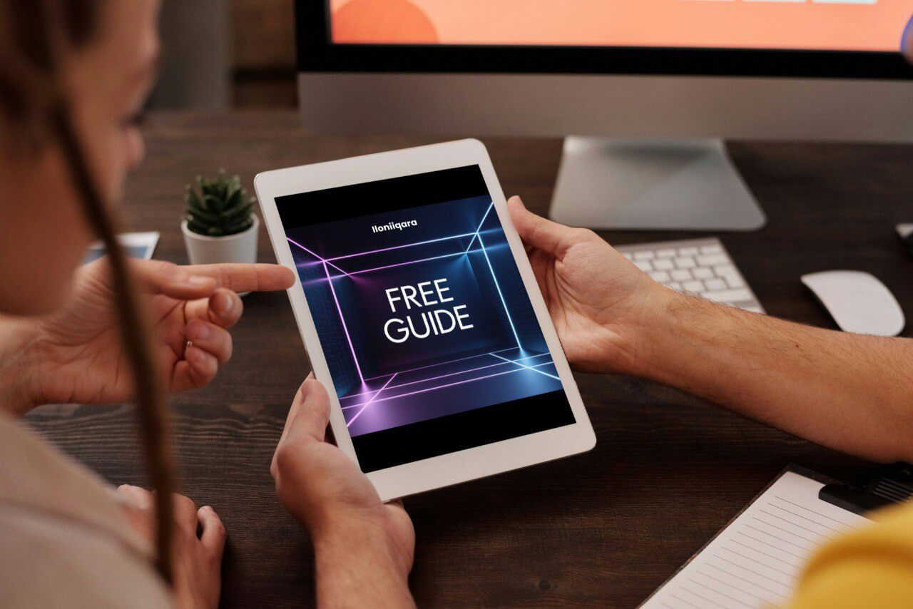 People learning 'Free Guide' displaying on a tablet