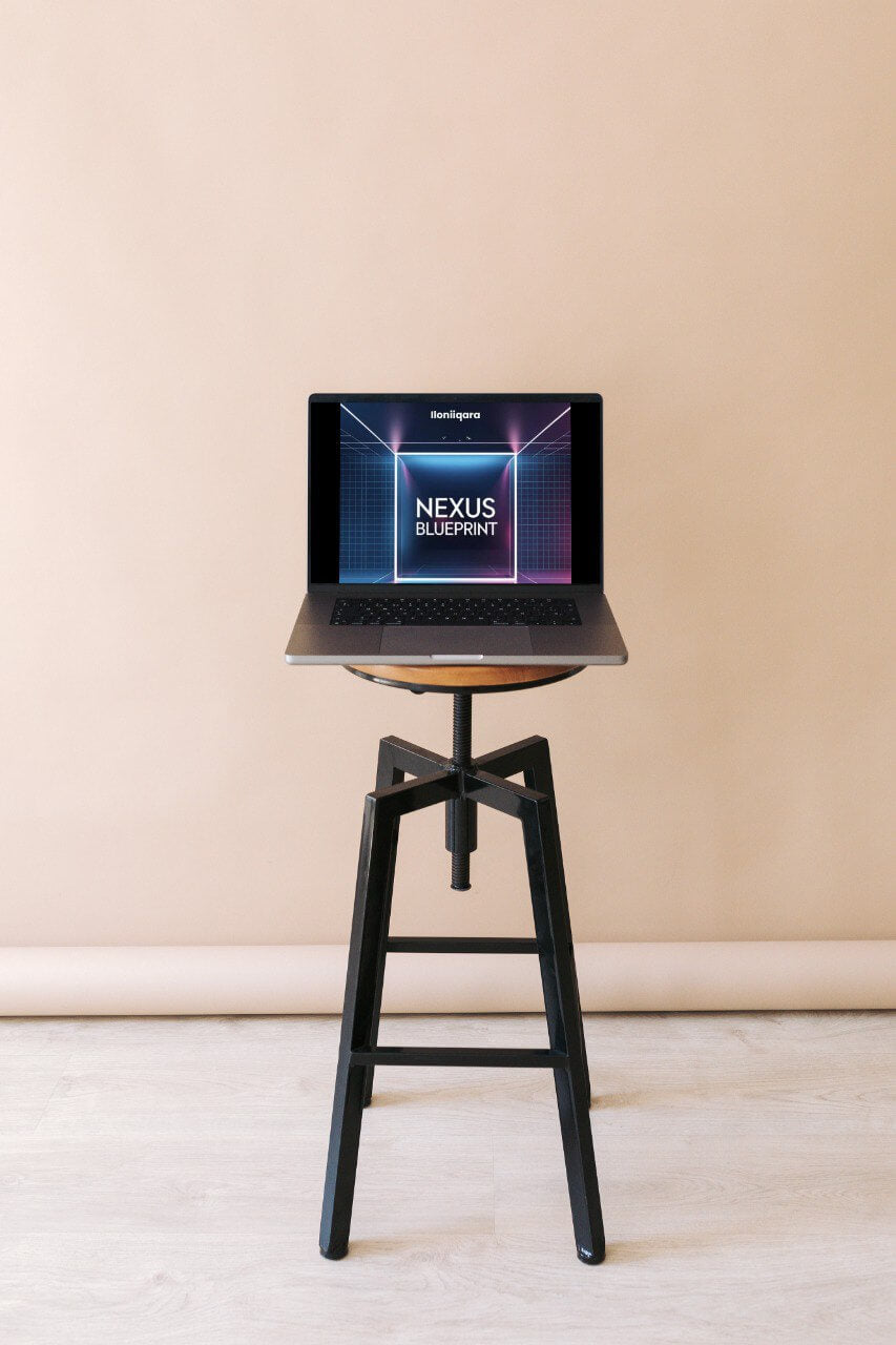 Laptop displaying 'Nexus Blueprint' guide on a black stool with a beige background