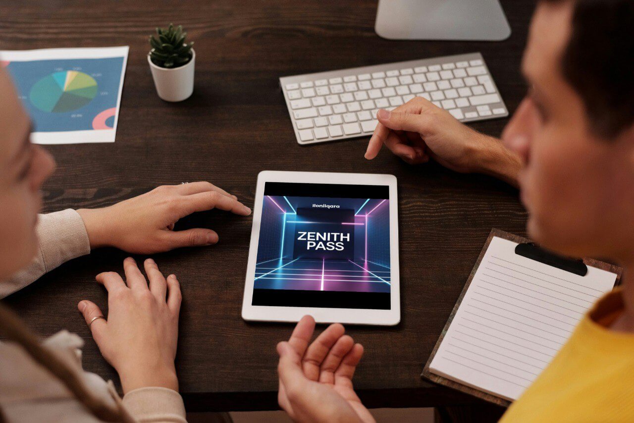 Two people interacting with a tablet displaying 'Zenith Pass' guide on a wooden desk.